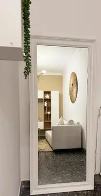 a view of a bedroom with a bed through a mirror at Dream House in Athens