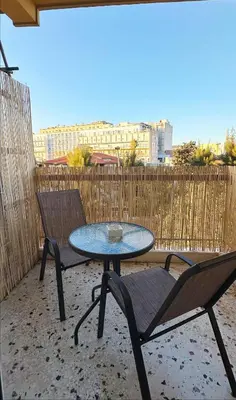 a table and two chairs sitting on a patio at Dream House in Athens