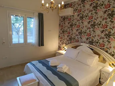 a bedroom with a bed with towels on it at Athens Royal Suite in Athens