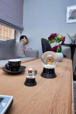 a coffee table with two domes on top of it at Glyfada's Luxury Design Apartment with balcony in Athens