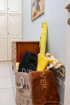 a room with a box filled with towels and a wall at Glyfada's Luxury Design Apartment with balcony in Athens