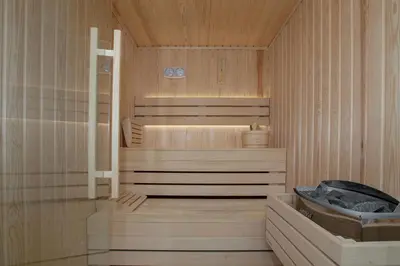 a sauna with a tub and a sink in it at Luxury Loft Sauna HotTub Psyhiko in Athens