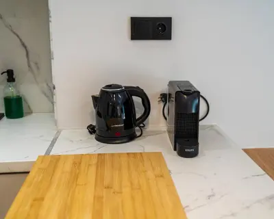 a coffee maker and a blender sitting on a counter at Kypseli urban Oasis in Athens
