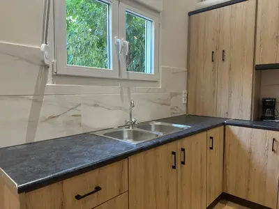 a kitchen with a sink and a window at Διαμέρισμα κοντά στο μετρό - Flat next to metro in Piraeus