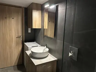a bathroom with a sink and a mirror at Διαμέρισμα κοντά στο μετρό - Flat next to metro in Piraeus