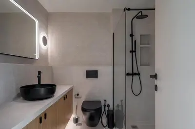a bathroom with a sink and a shower at The Portside Getaway - 2BR, 2BA Duplex in Piraeus in Piraeus