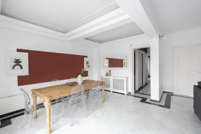 a dining room with a wooden table and chairs at Massive 2 Apartment Combo Unbeatable Acropolis Views Sleeps 9 in Athens