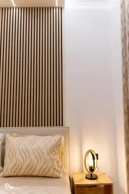 a bedroom with a bed with a black and white headboard at Danae's - Luxury & Modern Apartment in Egaleo-Athens in Athens