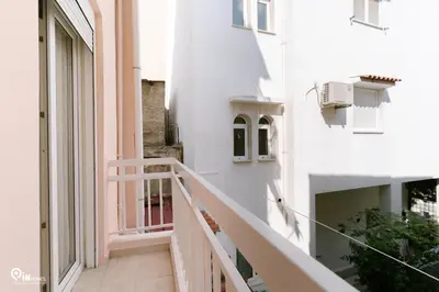 a corridor of a building with a white staircase at Danae's - Luxury & Modern Apartment in Egaleo-Athens in Athens