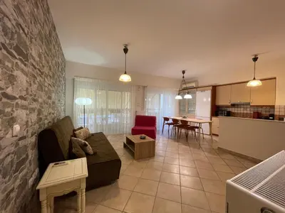 a living room with a couch and a table at Casa Nikos in Athens