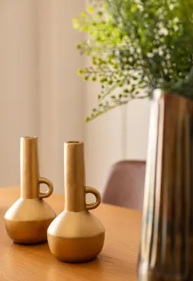 two vases sitting on a table next to a vase at The Athenian Aroma - 3BDRM Exclusive Residence in Athens