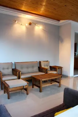 a living room with couches and a coffee table at Sea & garden view cozy apartment with good privacy in Athens