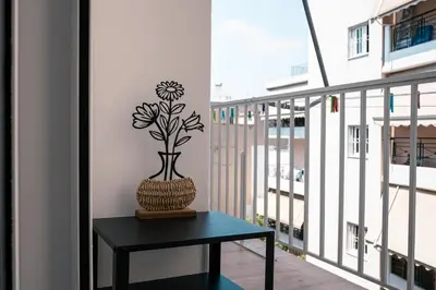 a vase sitting on top of a table on a balcony at City Chic Living-3BR Kallirrois in Athens