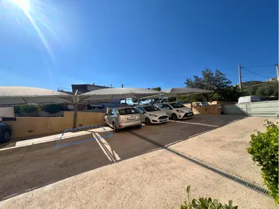a group of cars parked in a parking lot at Anavyssos Azure in Anavissos
