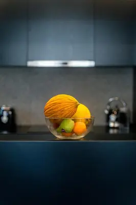 a bowl of fruit on a counter in a kitchen at Casa Aura-Artistic Living Faliro in Athens