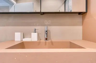 a bathroom sink with a faucet on a counter at Casa Aura-Artistic Living Faliro in Athens