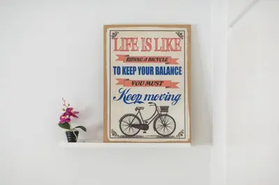 a framed picture of a bike in a room at Ground floor apartment, 100m from metro Panormou in Athens