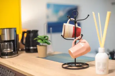 a pink lamp sitting on top of a counter at Ground floor apartment, 100m from metro Panormou in Athens