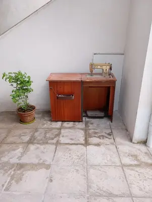 a wooden desk with a sink in a room with a plant at Lemon tree's House in Athens in Athens
