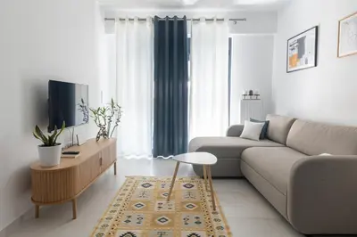 a living room with a couch and a table at Andria's Apartment in Athens