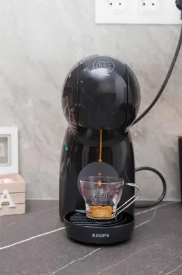a coffee maker sitting on a counter with a cup at Ilissos Harmony Apartment in Piraeus