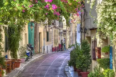 a street in an old town with flowers at Acropolis view, in the center of Athens! 4pl in Athens
