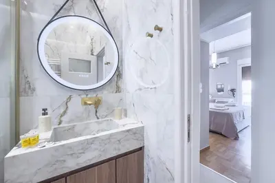 a bathroom with a sink and a mirror at Boutique Athens Flat in Koukaki, Walk to Acropolis in Athens