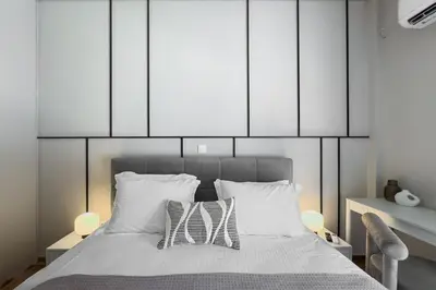a bedroom with a bed with two white pillows at Boutique Athens Flat in Koukaki, Walk to Acropolis in Athens