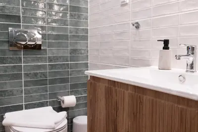 a bathroom with a sink and a toilet at Pagrati Art & Love in Athens