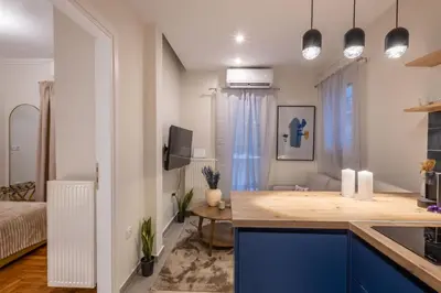 a kitchen with a counter top in a room at Pagrati Art & Love in Athens