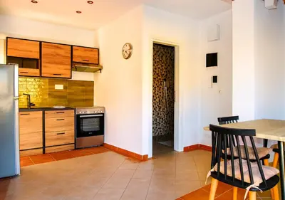 a kitchen with a table and a counter top at Panathenea Rooftop Apartment with Stunning View of Lycabettus in Athens