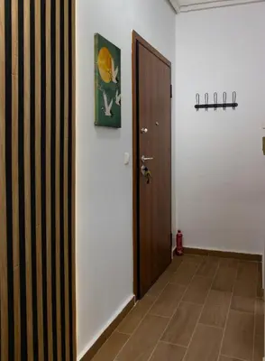 a hallway with a door and a wall at Mountain Haven - Japandi Style With 100Mbps Wi-Fi in Athens