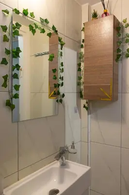 a bathroom with a sink and a mirror at Mountain Haven - Japandi Style With 100Mbps Wi-Fi in Athens