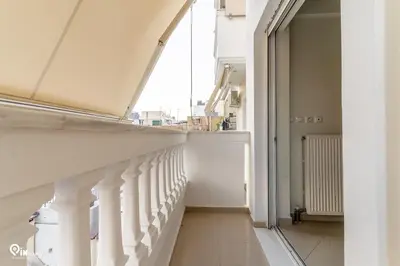 a hallway with a white staircase in a house at Emeralds - Premium & Modern Stay in Egaleo-Athens in Athens