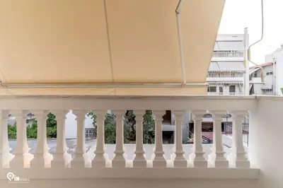 a balcony with white railings in a building at Emeralds - Premium & Modern Stay in Egaleo-Athens in Athens