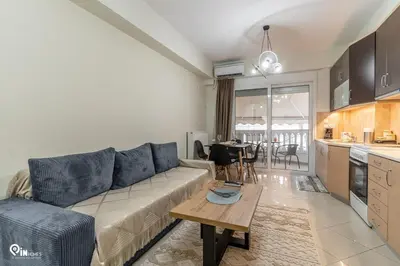 a living room with a couch and a table at Rubies - Premium And Comfy Stay in Egaleo-Athens in Athens