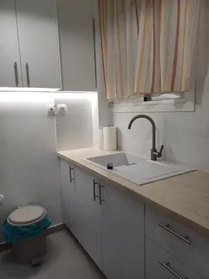 a small kitchen with a sink and a toilet at Harmony Athens city apartment in Athens