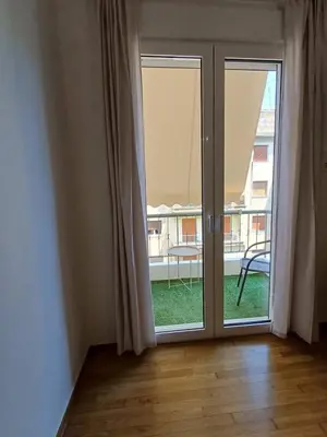 an open glass door with a view of a balcony at Harmony Athens city apartment in Athens