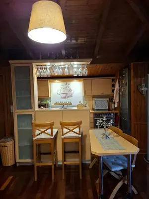 a kitchen with a table and two chairs and a sink at Rooftop bliss in Athens