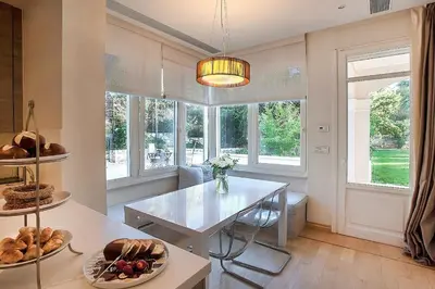 a living room with a table and some bread at GT Dreams Villa - Luxury Villa near the Athenian Riviera in Vari