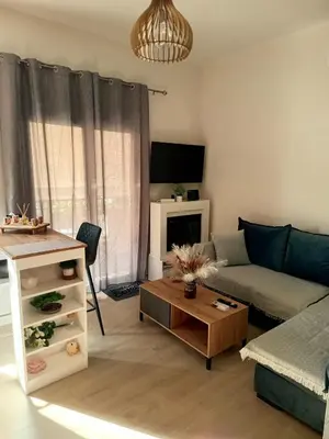 a living room with a couch and a coffee table at PK luxury apartment in Athens