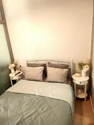 a bedroom with a bed with two side tables at PK luxury apartment in Athens