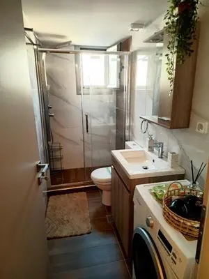 a bathroom with a shower and a toilet and a sink at PK luxury apartment in Athens