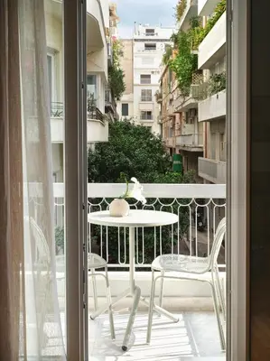 a view of a balcony with a table and chairs at 30one Kolonaki Apartment in Athens