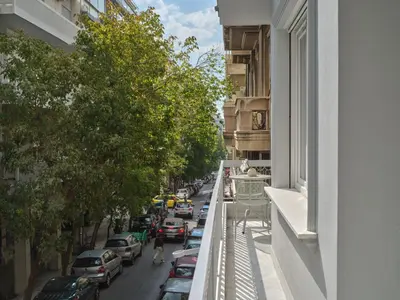 a view from a balcony of a street with cars at 30one Kolonaki Apartment in Athens