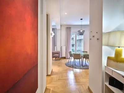 a hallway with a living room and a dining room at 30one Kolonaki Apartment in Athens