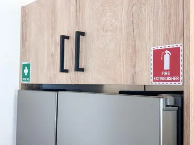 a refrigerator with a sign on top of it at Boho Flat in Glyfada Center in Athens