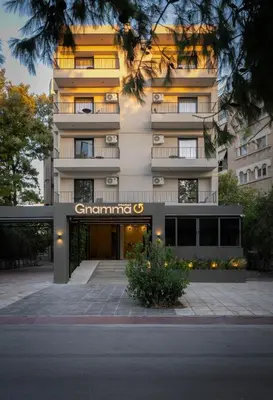a building with a sign on the front of it at Gnamma Hotel in Athens