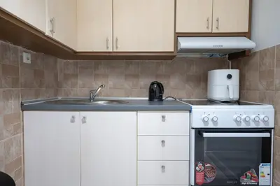 a kitchen with a sink and a stove at Petralona Hideaway - Comfort for 4 by ΜΡS in Athens