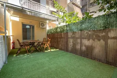 a patio with a table and chairs and a fence at Petralona Hideaway - Comfort for 4 by ΜΡS in Athens